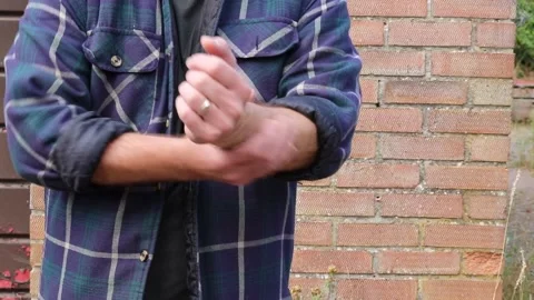 Man scratching his arm Stock Footage 205846144