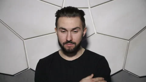 Man is scratching his beard Stock Footage 86255020