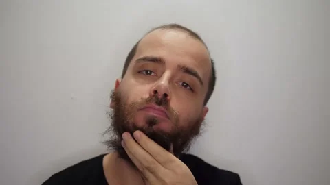 Man scratching his big beard Stock Footage 169769822