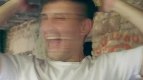 Man screaming and shaking head in motion blur Stock Footage 304516772