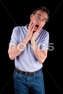 Man screaming in horror hands to face Stock Photos
