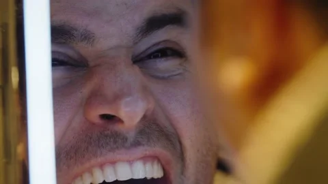 Man screaming in mirror Stock Footage 168477504