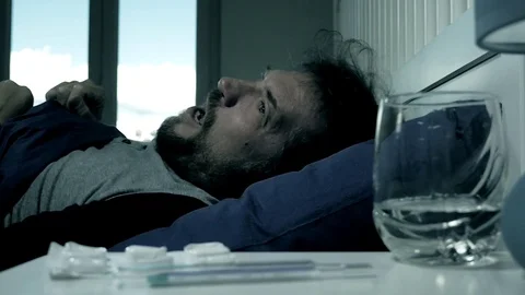 Man screaming for strong headache feeling pain in bed slow motion Stock Footage 76748959