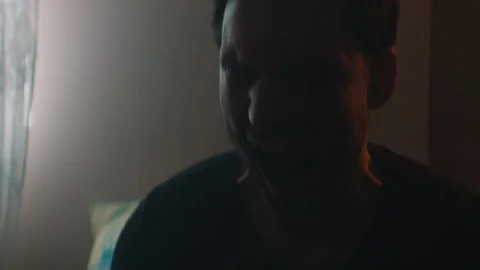 Man screaming while sitting at home Stock Footage 131398258