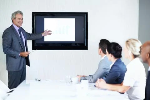 Man, screen and tablet in presentation with pointing, graphs or revenue info at Stock Photos