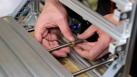 Man screw the rod into the platform Stock Footage 81040045