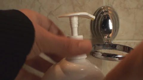 Man Screwing The Head Of A Liquid Soap Dispenser Point Of View Stock Footage 36292349
