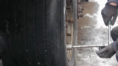 Man Screwing The Wheel Stock Footage 169489198