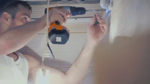 Man screws the bolts Stock Footage 77196146