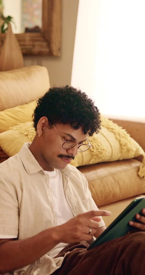 Man, scroll and remote work in house with tablet, glasses and creativity for Stock Footage 342835906