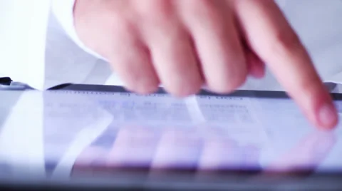 MAN SCROLL A TABLET DISPLAY Stock Footage 28195027