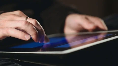 Man scrolling and scaling On His Tablet Video stock 80170844