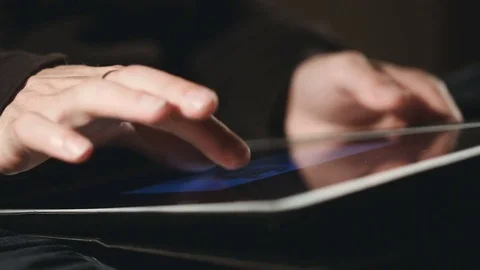 Man scrolling and scaling On His Tablet Video stock 80170870