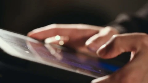 Man scrolling and scaling On His Tablet Видео 80170932