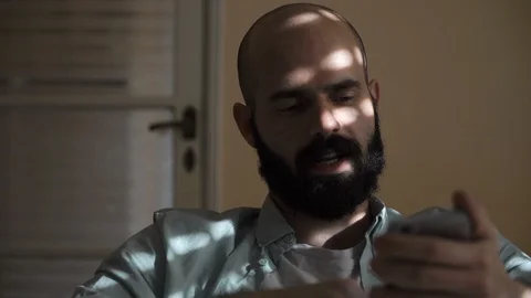 Man Scrolling Down his Smartphone Video stock 85604544