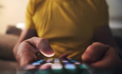 Man Scrolling To Find Application On Smartphone Screen Stock Photos