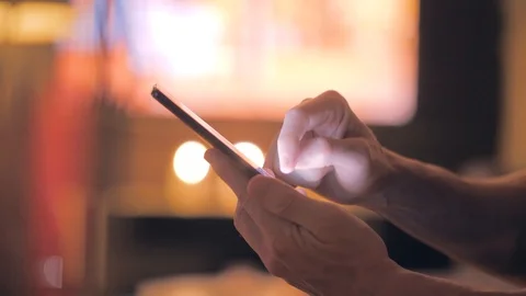 Man scrolling on the internet on a smartphone Stock Footage 110690228