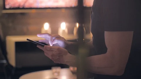 Man scrolling on the internet on a smartphone Stock Footage 110690511