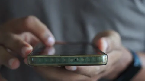 Man scrolling mobile phone screen. internet browsing, social media and marketing Stock Footage 328646443