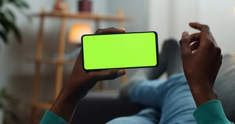 Man scrolling smartphone mock up screen while holding it in horizontal landscape Stock-Footage 128303881