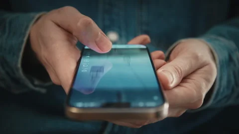 Man scrolling social media feed on smartphone. Swipe motion blur phone screen Stock Footage 328199696