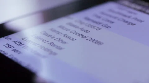 Man scrolling through bank statement on tablet computer Stock Footage 34492461