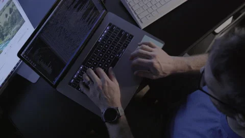 Man Scrolling Through Code Video stock 208746644