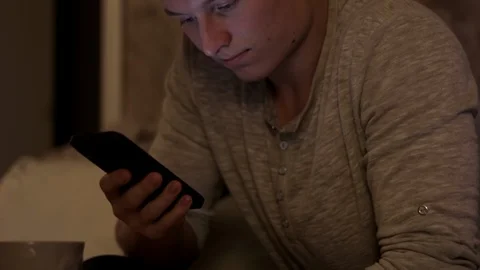 Man scrolling through his smartphone, Mid Shot Stock Footage 97828716