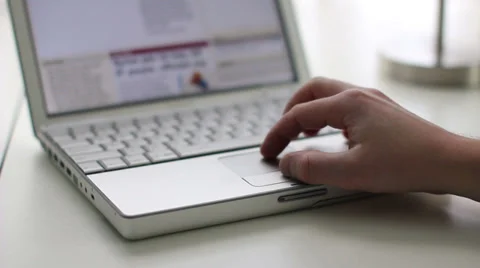 Man scrolling a website using a laptop track pad Stock Footage 39758382