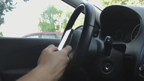 A man scrolls a mobile phone in a car close up Stock Footage 165296918
