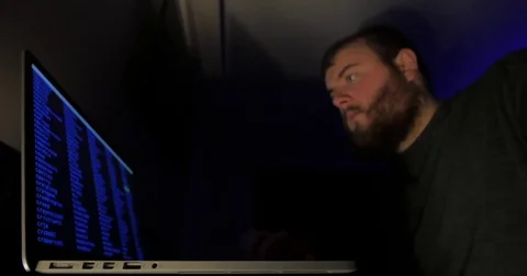 Man scrolls through code very fast on a server remotely Stock Footage 81948198