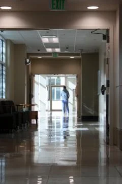 Man in scrubs -  hospital hallway Stock Photos
