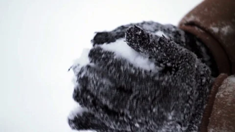 Man sculpts snow in gloves Stock Footage 70679945