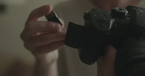 Man with SD card for digital camera at home Video stock 78037794