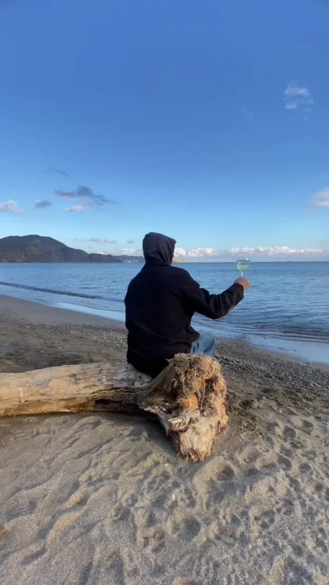 Man by the sea with wine Stock Footage 320354472