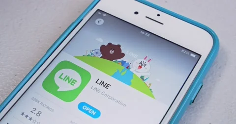Man searches LINE app and watches App Store introduction on iPhone Stock Footage 161766950