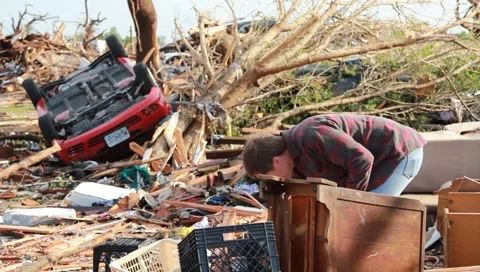 Man Searches Through Tornado Rubble (HD) co Stock Footage 5425494