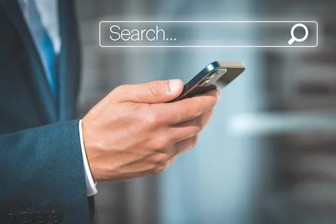 Man searching internet data information in smartphone. Search bar. Online search Stock Photos