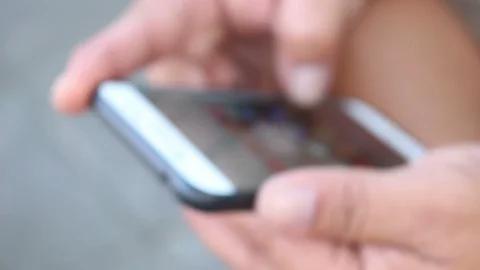Man searching internet with smartphone, blur shot Stock Footage 123469722