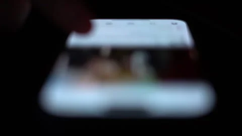 Man searching social networks using smartphone Stock Footage 260953440