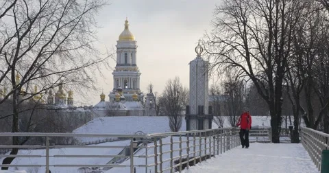 Man is Searching Something in a Pocket Standing on a Bridge in Park Walking and Video stock 58820757