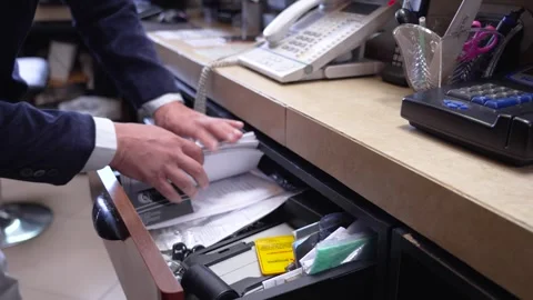 Man Searching Through Drawer for Items - Indoor Scene 動画素材 285917829