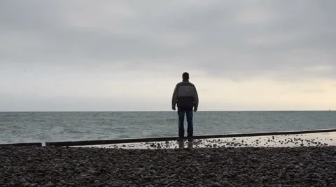 Man at the seashore raising hands Stock-Footage 59703758