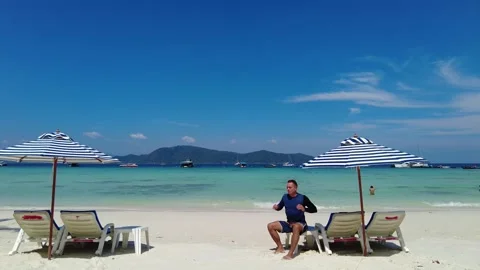 A man on the seashore tries to relax Stock Footage 315874388