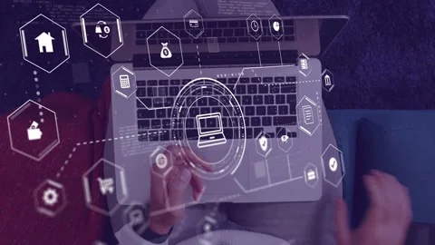 Man seated with laptop placing object down, activating tech HUD, hex icons Stock Footage 335466160