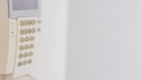 A man secures his home by setting the alarm before heading out for the day 스톡 동영상 281606178