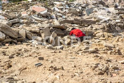 Man is seeking for some treasure after thai tsunami Stock Photos