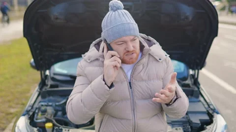 A man is seen on the phone, possibly calling for a Stock Footage 234692306