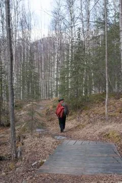 A man is seen walk along a path. Stock Photos