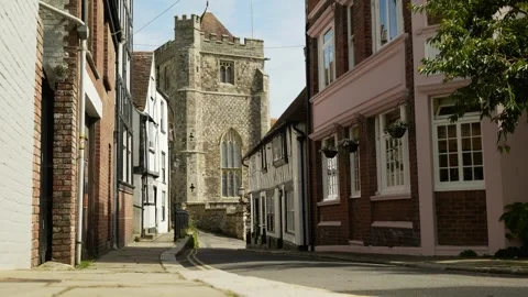 A man seen walking through Hastings street past a church 6K Stock Footage 329900636